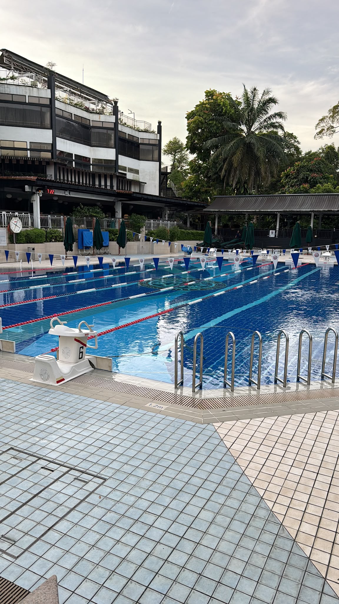 Outdoor competition swimming pool with lane lines and starting blocks